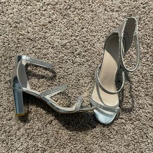 Silver high heeled shoes